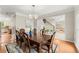 Elegant dining room featuring a chandelier, hardwood floors, and views of other living spaces at 789 Rutland Ct, Lithonia, GA 30058