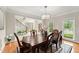 Formal dining room with hardwood floors, a chandelier, and views into the foyer and living areas at 789 Rutland Ct, Lithonia, GA 30058
