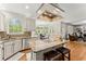 Charming kitchen with central island, granite countertops, and sunny breakfast nook at 789 Rutland Ct, Lithonia, GA 30058