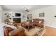 Inviting living room with hardwood floors, a fireplace, and comfortable seating arrangements at 789 Rutland Ct, Lithonia, GA 30058