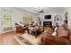 Cozy living room with a fireplace, built-in shelves, and comfortable leather seating at 789 Rutland Ct, Lithonia, GA 30058
