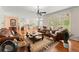 Comfortable living room features elegant furnishings, hardwood floors, and seamless flow into sunroom at 789 Rutland Ct, Lithonia, GA 30058