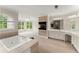 Bright primary bathroom featuring double sinks, a jacuzzi tub, and natural light at 789 Rutland Ct, Lithonia, GA 30058