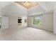 Spacious main bedroom with natural light, neutral carpet, a fireplace, and views to the exterior yard at 789 Rutland Ct, Lithonia, GA 30058