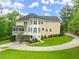 Spacious home exterior featuring a screened porch, deck, and manicured lawn, perfect for outdoor entertaining at 789 Rutland Ct, Lithonia, GA 30058