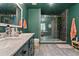 A modern bathroom featuring a glass enclosed walk-in shower, double vanity and modern fixtures at 1033 Justice Nw Ln, Acworth, GA 30102