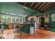 Large kitchen with central island, hardwood floors, green walls and ceilings, and lots of sunlight at 1033 Justice Nw Ln, Acworth, GA 30102