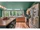A gorgeous kitchen boasts stainless steel appliances, butcher block countertops, and a large island at 1033 Justice Nw Ln, Acworth, GA 30102