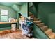 Laundry area featuring a washer and dryer under a staircase, with hardwood floors at 1033 Justice Nw Ln, Acworth, GA 30102