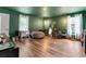 A green room featuring two large windows, a beanbag, and minimalist decor at 1033 Justice Nw Ln, Acworth, GA 30102