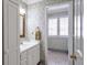 Bathroom featuring a vanity with white cabinets, and a separate area with shuttered windows at 2190 Stephen Long Ne Dr, Atlanta, GA 30305