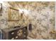 Charming powder room with decorative wallpaper and elegant fixtures at 2190 Stephen Long Ne Dr, Atlanta, GA 30305