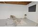 Finished basement area with seating, a TV, and painted white walls at 225 River Springs Dr, Sandy Springs, GA 30328