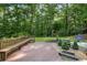 Inviting backyard deck with built-in seating, creating an ideal space for gatherings and enjoying the serene surroundings at 225 River Springs Dr, Sandy Springs, GA 30328