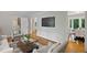 Comfortable living room with hardwood floors, cozy seating, and seamless access to the dining area at 225 River Springs Dr, Sandy Springs, GA 30328