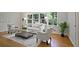 Bright living room with hardwood floors, stylish furniture, and large windows offering views of the lush greenery at 225 River Springs Dr, Sandy Springs, GA 30328