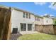 This backyard includes a small patio and a grassy area at 129 Finsbury Ln, Woodstock, GA 30188