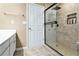 This modern bathroom features a glass shower with a tile surround and niche at 129 Finsbury Ln, Woodstock, GA 30188