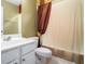 This bathroom has a single sink vanity with a large framed mirror and a shower/tub combo at 129 Finsbury Ln, Woodstock, GA 30188
