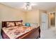 This bedroom is roomy and includes a ceiling fan and double door closet at 129 Finsbury Ln, Woodstock, GA 30188