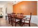 Inviting dining room with beautiful hardwood floors and a traditional chandelier at 129 Finsbury Ln, Woodstock, GA 30188