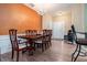 Inviting dining room with beautiful hardwood floors and a traditional chandelier at 129 Finsbury Ln, Woodstock, GA 30188