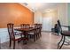 Elegant dining room with wood floors, a chandelier, and a dining table with seating for six at 129 Finsbury Ln, Woodstock, GA 30188