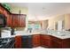 Well-equipped kitchen with granite countertops, stainless steel appliances, and ample cabinet space at 129 Finsbury Ln, Woodstock, GA 30188