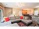 Inviting living room with comfortable seating, a bar top and a dining area at 129 Finsbury Ln, Woodstock, GA 30188