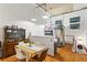 Charming dining area features hardwood floors, a wooden table with seating for six, and stainless steel appliances at 19 Hilliard Se St # 13, Atlanta, GA 30312