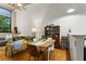 Sunlit dining area features wood floors, a table with seating for six, and a classic display cabinet at 19 Hilliard Se St # 13, Atlanta, GA 30312