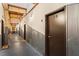 Hallway view featuring corrugated metal siding, exposed wood, and industrial-style lighting at 19 Hilliard Se St # 13, Atlanta, GA 30312
