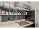 A well-organized kitchen area featuring open shelving, marble counters, and a stainless-steel sink at 19 Hilliard Se St # 13, Atlanta, GA 30312