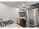 Well-equipped kitchen features stainless steel appliances, granite countertops, and functional shelving for storage at 19 Hilliard Se St # 13, Atlanta, GA 30312