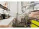Bright laundry room with white countertop, front-load washer/dryer, and storage shelves at 19 Hilliard Se St # 13, Atlanta, GA 30312