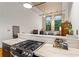 Open-concept living area with modern kitchen island, stainless steel range, and lots of natural light at 19 Hilliard Se St # 13, Atlanta, GA 30312