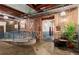 Open lobby with exposed brick, spiral staircase and ample natural light at 19 Hilliard Se St # 13, Atlanta, GA 30312