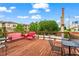 Rooftop deck with seating, a vibrant cityscape and a sunny sky at 19 Hilliard Se St # 13, Atlanta, GA 30312