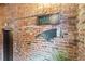 Exposed brick featuring a Welcome sign for 19 Hilliard Street, and an adjacent elevator at 19 Hilliard Se St # 13, Atlanta, GA 30312