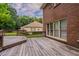 Wooden back deck area is connected to a brick building at 214 Jamestown Ave, Jonesboro, GA 30236