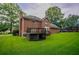 Lovely brick home with a large backyard and inviting deck space at 214 Jamestown Ave, Jonesboro, GA 30236