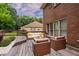 Backyard deck with furniture perfect for relaxing and entertaining at 214 Jamestown Ave, Jonesboro, GA 30236