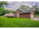 Beautiful brick home with a spacious backyard, detached garage, and well-manicured lawn at 214 Jamestown Ave, Jonesboro, GA 30236