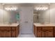 Elegant bathroom featuring dual vanities with framed mirrors and recessed lighting at 214 Jamestown Ave, Jonesboro, GA 30236