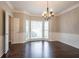 Light and airy dining room with a bay window and hardwood floors at 214 Jamestown Ave, Jonesboro, GA 30236