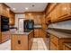 Kitchen featuring an island with cooktop and modern stainless steel appliances at 214 Jamestown Ave, Jonesboro, GA 30236