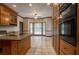 Well-appointed kitchen featuring an island, stainless appliances and tile flooring at 214 Jamestown Ave, Jonesboro, GA 30236