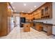 Spacious kitchen with granite countertops, stainless steel appliances, and custom cabinetry at 214 Jamestown Ave, Jonesboro, GA 30236