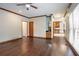 Living room with hardwood floors, a wet bar, and views to the outside patio and the kitchen at 214 Jamestown Ave, Jonesboro, GA 30236