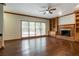 Elegant living room featuring hardwood floors, fireplace, and built-in shelving at 214 Jamestown Ave, Jonesboro, GA 30236
